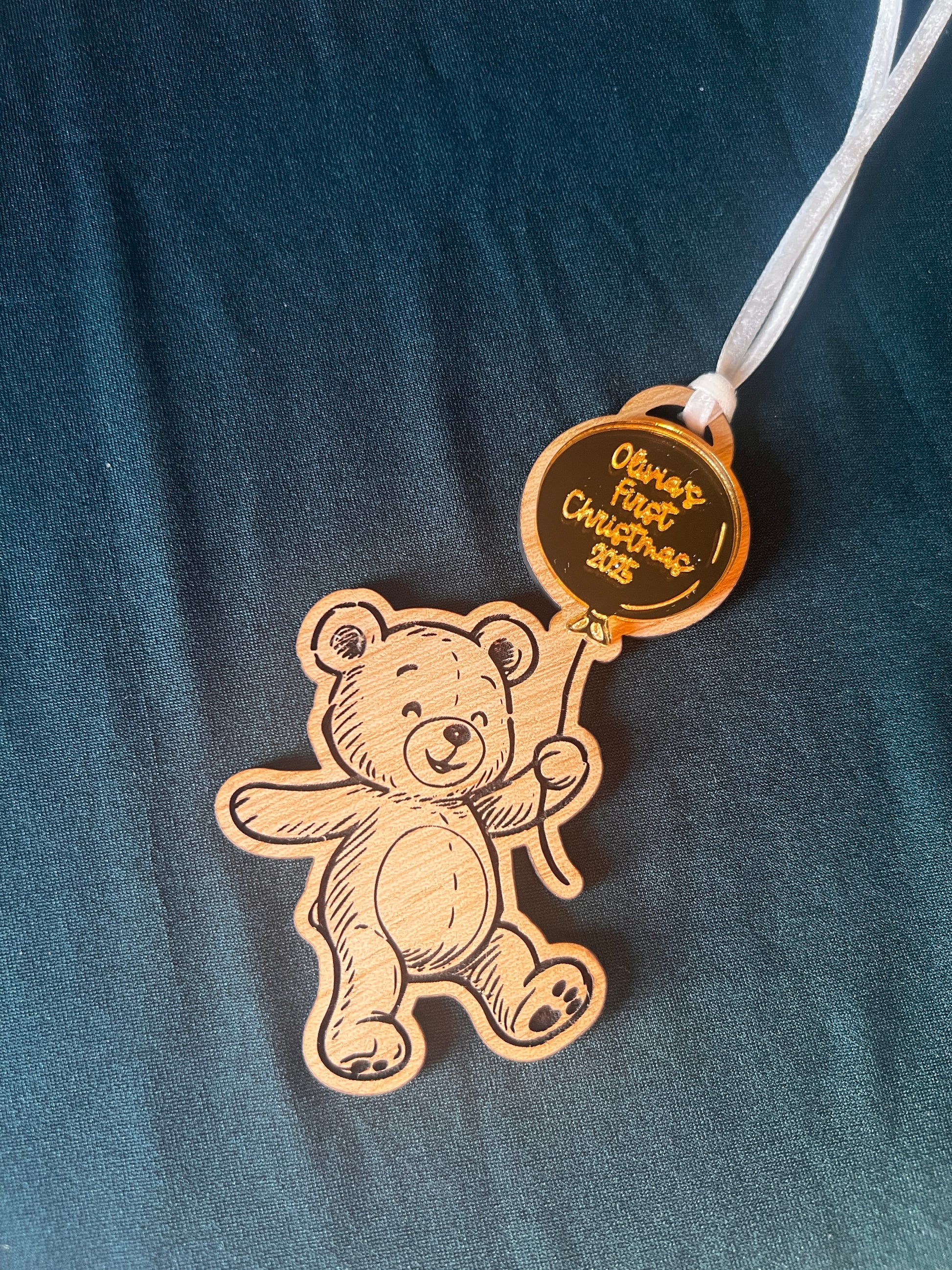 Wooden bear ornament with a 'First Christmas' 