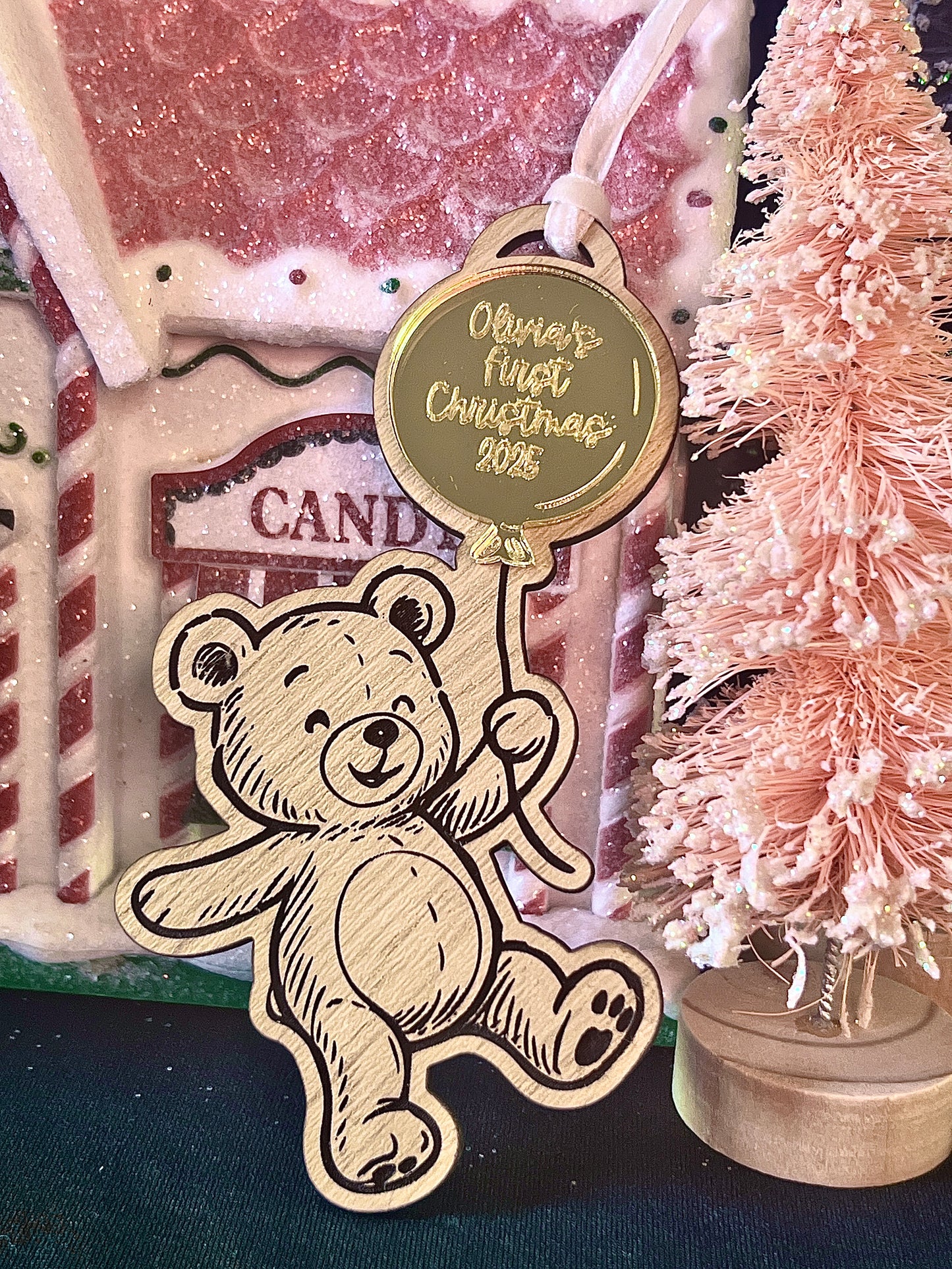 Wooden bear ornament with a 'First Christmas' 