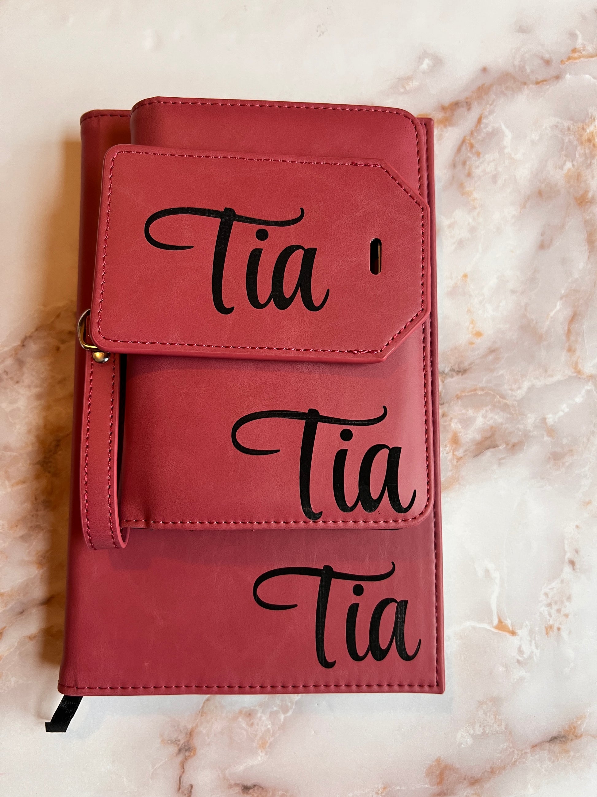 leather travel set with a notebook, wallet, and luggage tag 