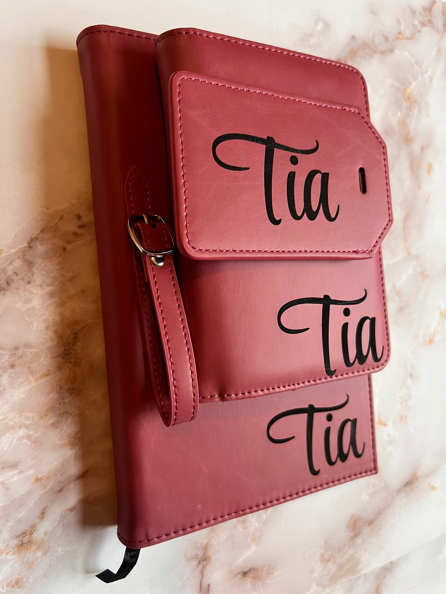 leather travel set with a notebook, wallet, and luggage tag 