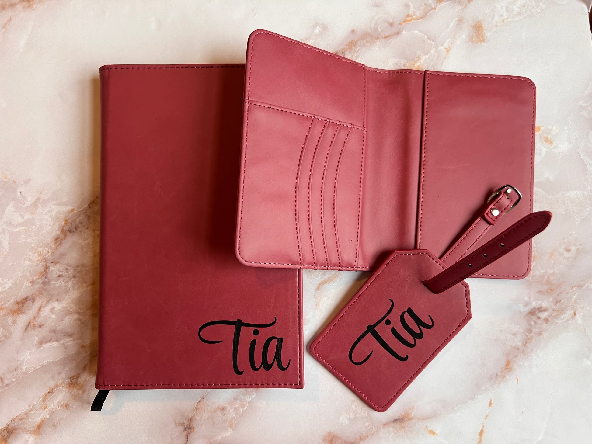 leather travel set with a notebook, wallet, and luggage tag 